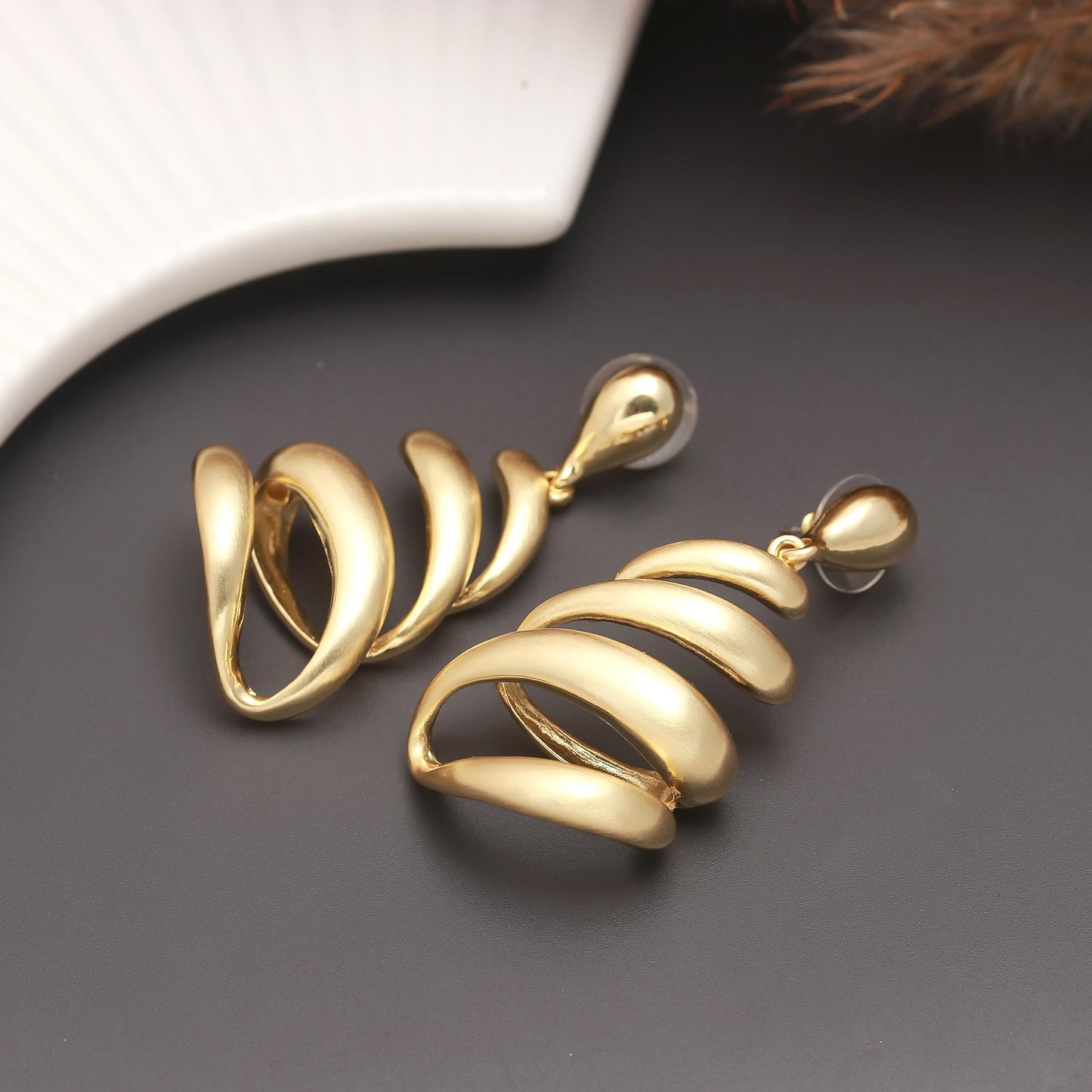 Gold-Plated Spiral Drop Earrings with Fluid Layered Swirl Design and Polished Finish for Bold Festive Glamour