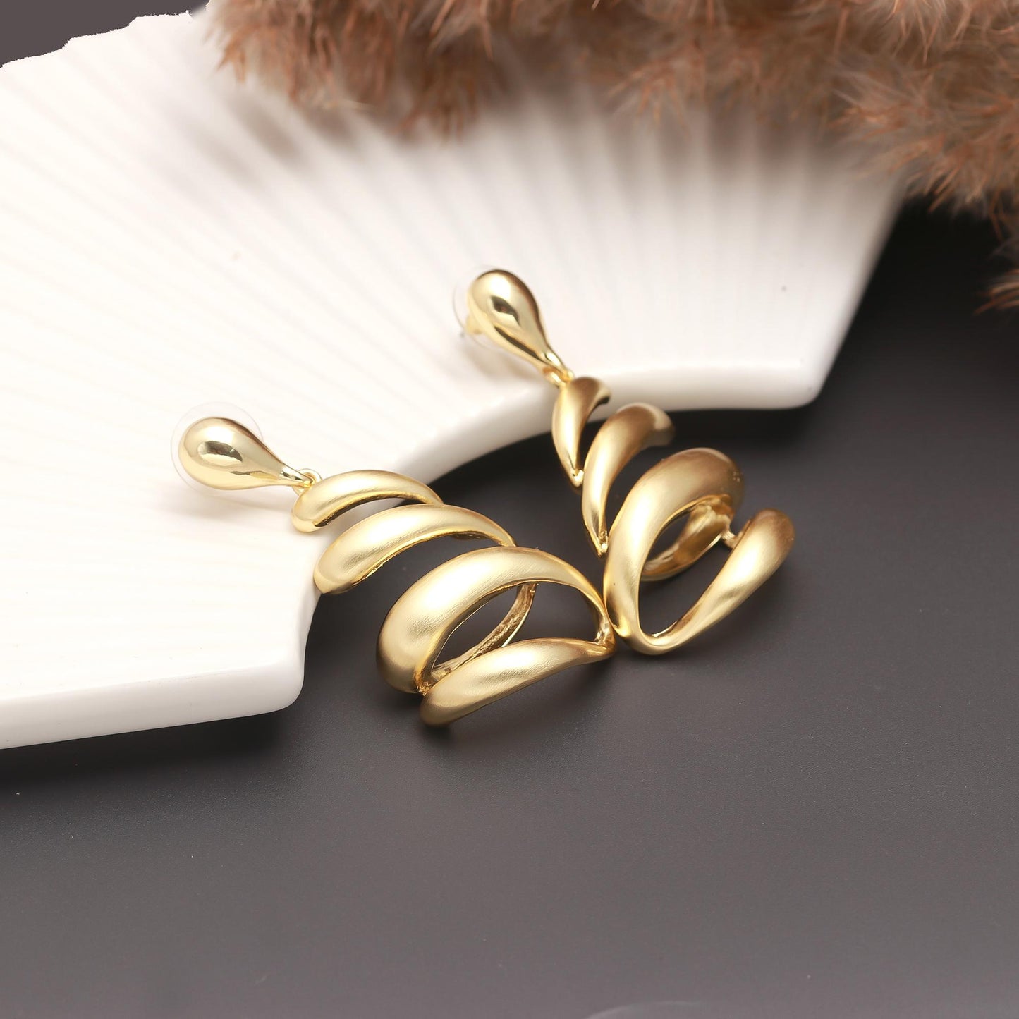 Gold-Plated Spiral Drop Earrings with Fluid Layered Swirl Design and Polished Finish for Bold Festive Glamour