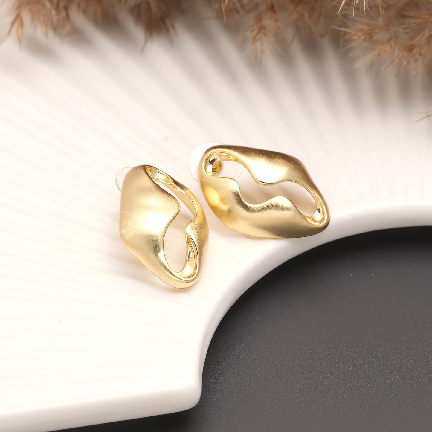 Gold-Plated Abstract Hollow Stud Earrings with Organic Curved Silhouette and Polished Finish for Contemporary Minimalist Elegance