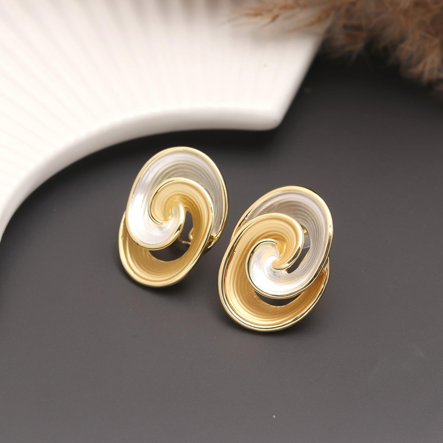 Gold-Plated Dual-Tone Swirl Stud Earrings with Glossy Polished Finish and Artistic Spiral Design for Modern Elegance