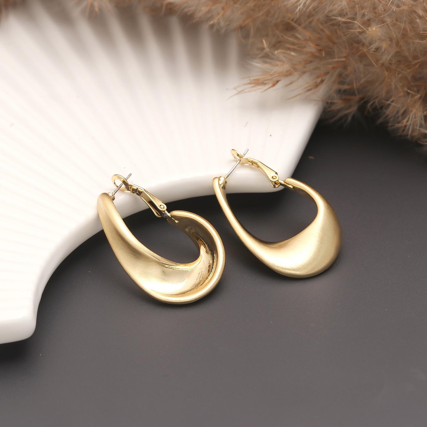Gold-Plated Sleek Teardrop Hoop Earrings with Smooth Curved Silhouette and Glossy Finish for Modern Minimalist Glamour