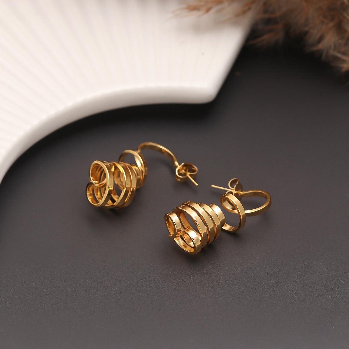 Contemporary Gold-Plated Spiral Drop Earrings with Layered Loops, Cascading Design, and Polished Finish for Modern Elegance and Statement Style