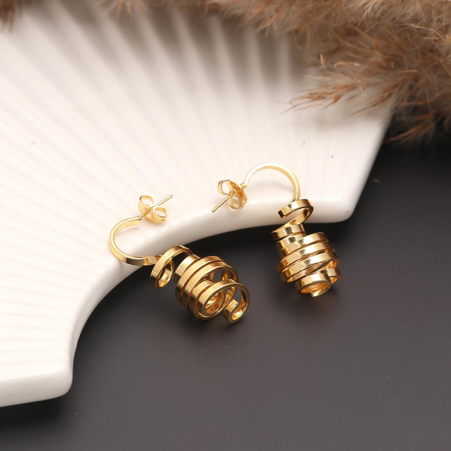 Contemporary Gold-Plated Spiral Drop Earrings with Layered Loops, Cascading Design, and Polished Finish for Modern Elegance and Statement Style