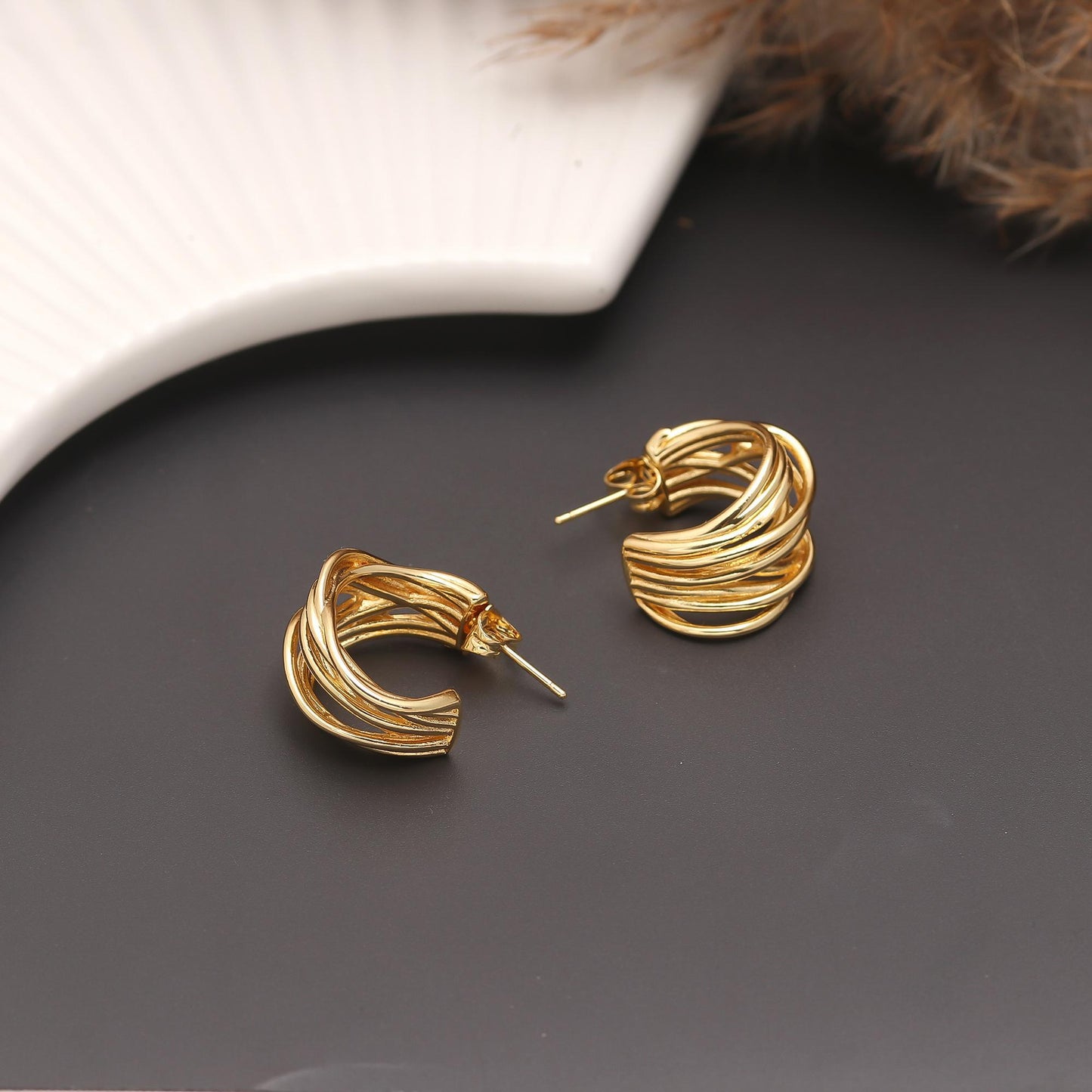 Elegant Gold-Plated Twisted Hoop Earrings with Interwoven Layers, Polished Finish, and Contemporary Statement Design for Everyday Glamour