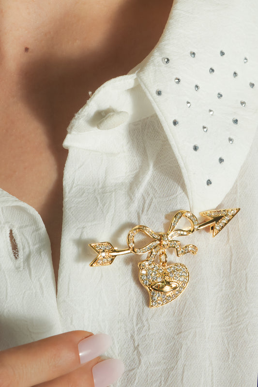 Cupid’s Bow & Heart Brooch | Gold-Tone Pave Arrow Pin with Dangling Heart Charm, Bow Accent & Clear CZ Stones | Romantic Statement Brooch