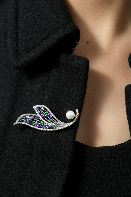 Amethyst and Emerald Feather Brooch | Silver Tone Wing Inspired Brooch with Purple Teardrop and Green Round CZ Stones, Full Pave Finish and Pearl Accent | Elegant Festive and Bridal Statement Pin