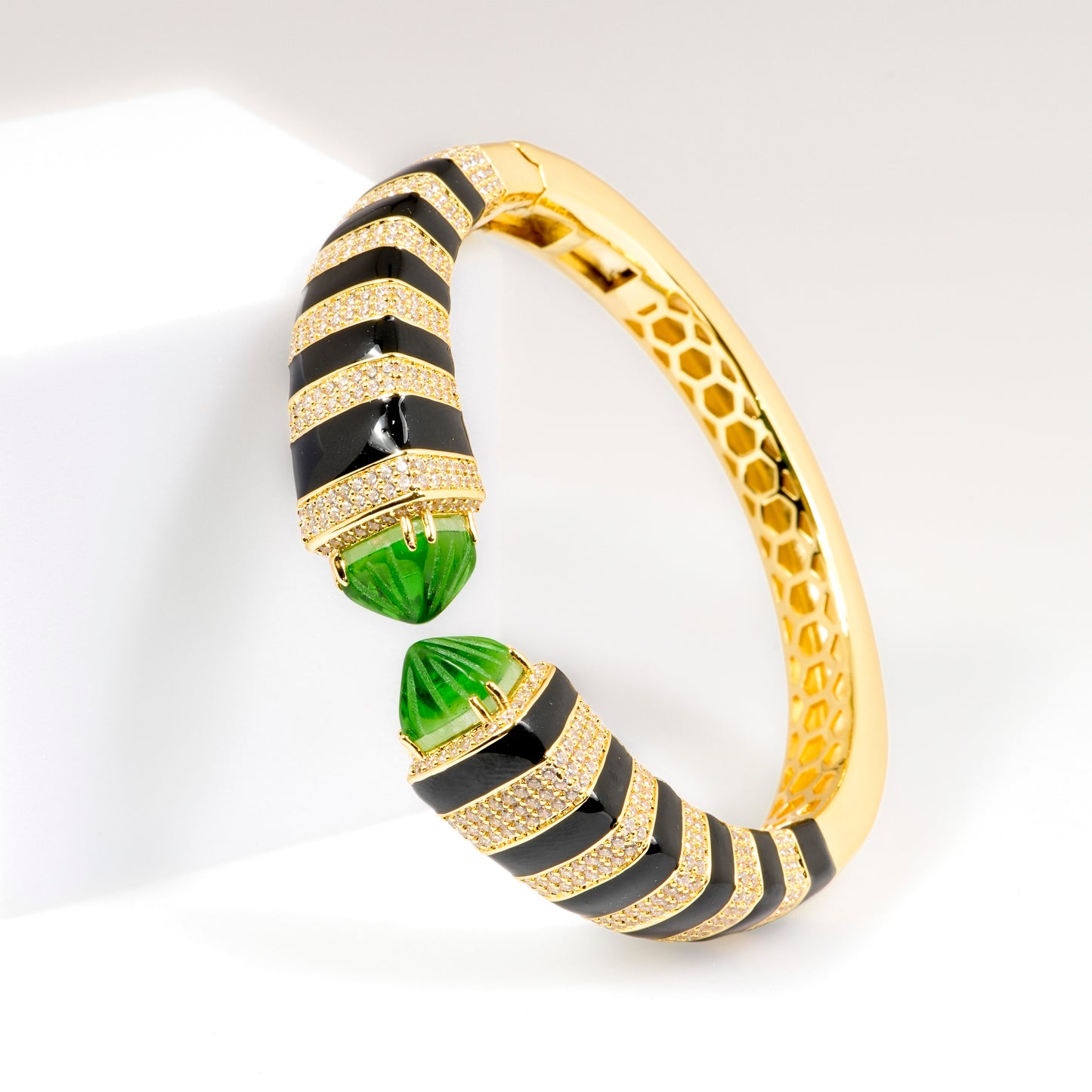 Gold Finish Open Cuff Bracelet with Black Enamel Stripes and Green Gemstone Tips | Luxury Statement Jewelry for Glamorous Occasions