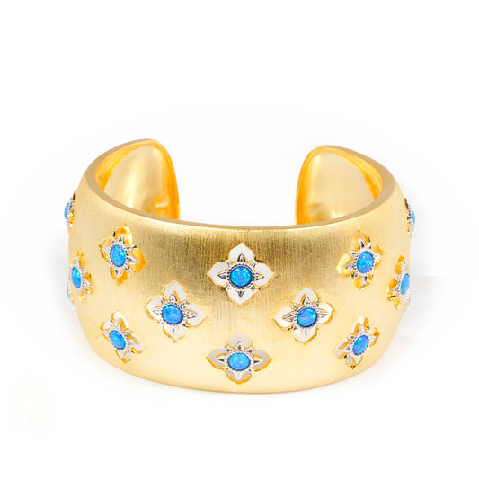 Wide Gold Cuff Bracelet with Intricate Blue Stone Floral Motifs and Satin Finish | Regal Statement Jewelry for Weddings, Festivals, and Special Occasions