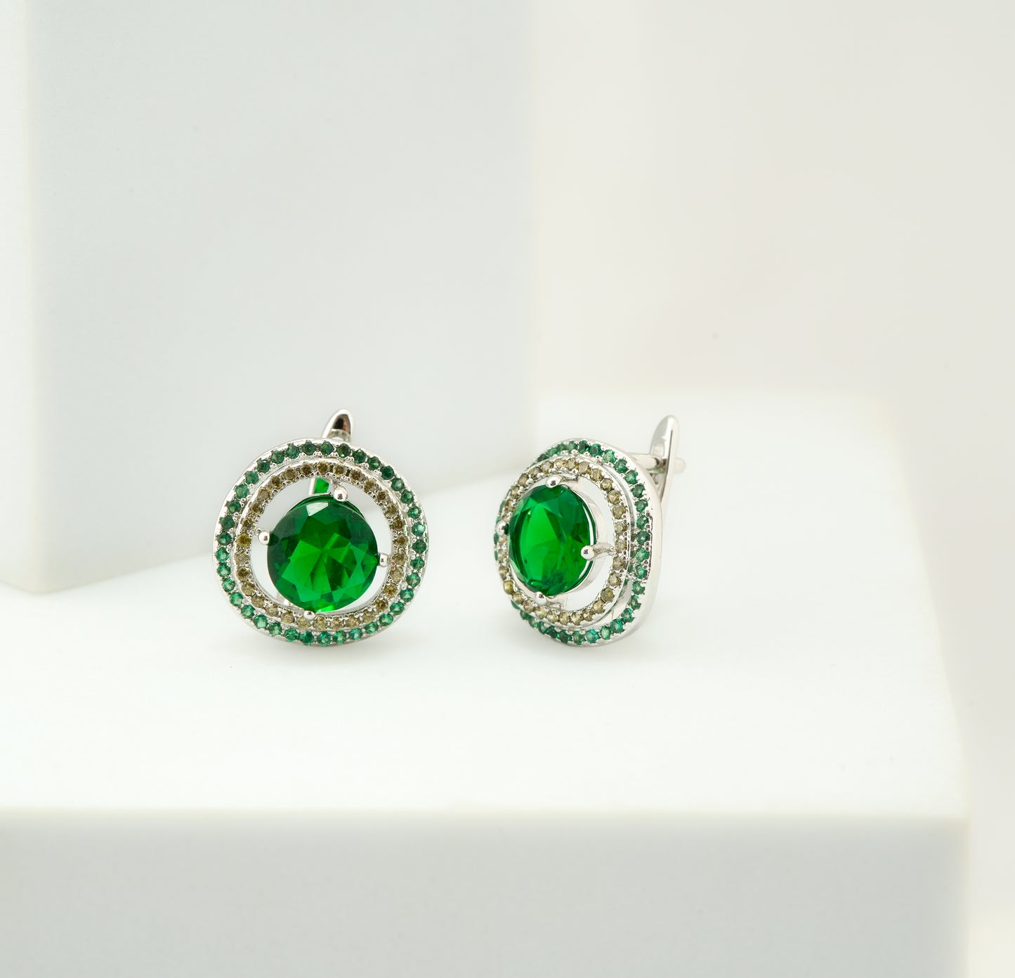Radiant Silver-Plated Round Stud Earrings with Emerald Green Center Stone and Dual Halo of Crystals for Timeless Sophistication