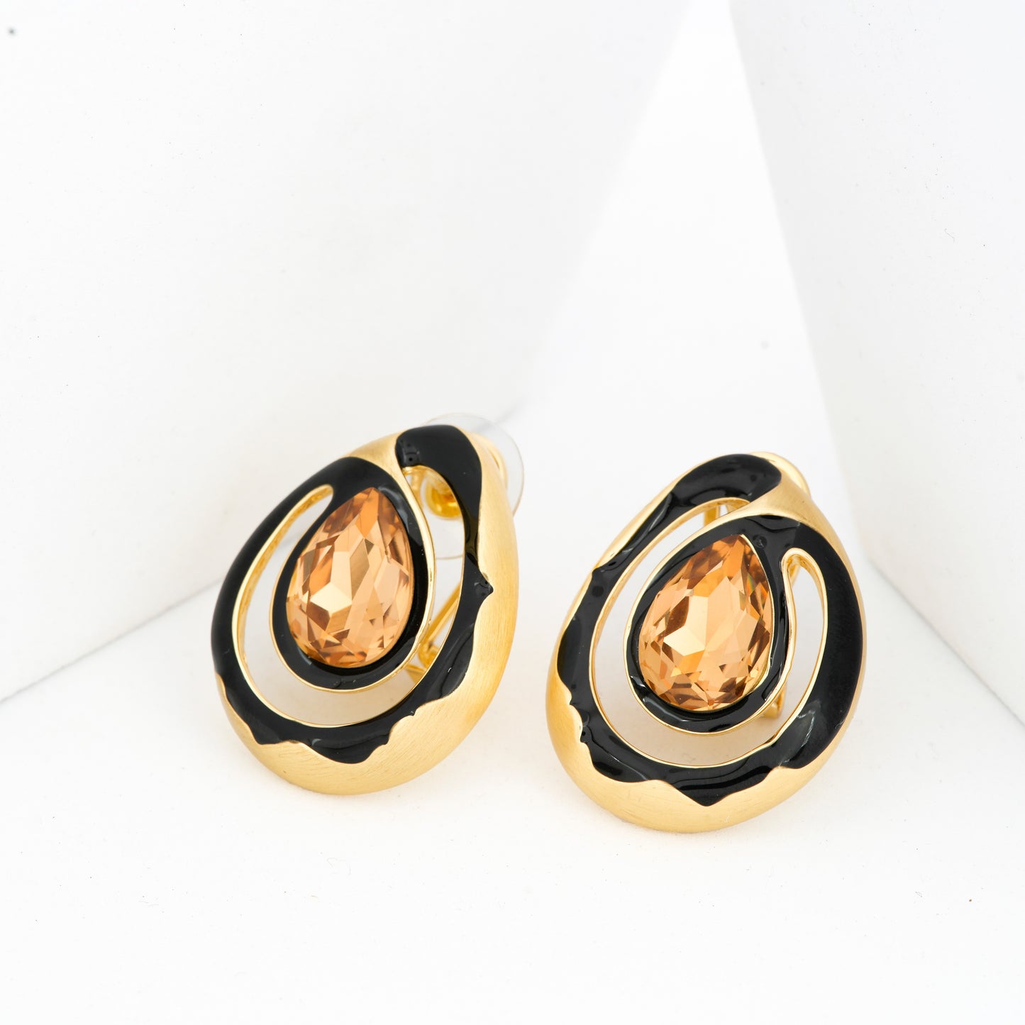 Golden Teardrop Earrings with Amber-Colored Gemstone and Black Enamel Accents