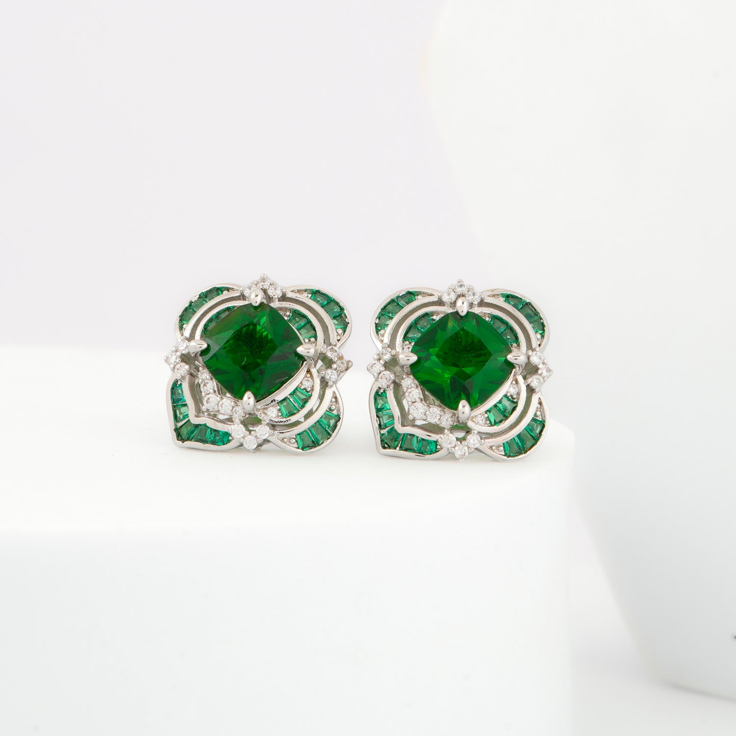 Exquisite Green Emerald Stud Earrings with Diamond Detailing in a Silver Floral Frame | Elegant Jewelry for Weddings, Parties, and Everyday Sophistication