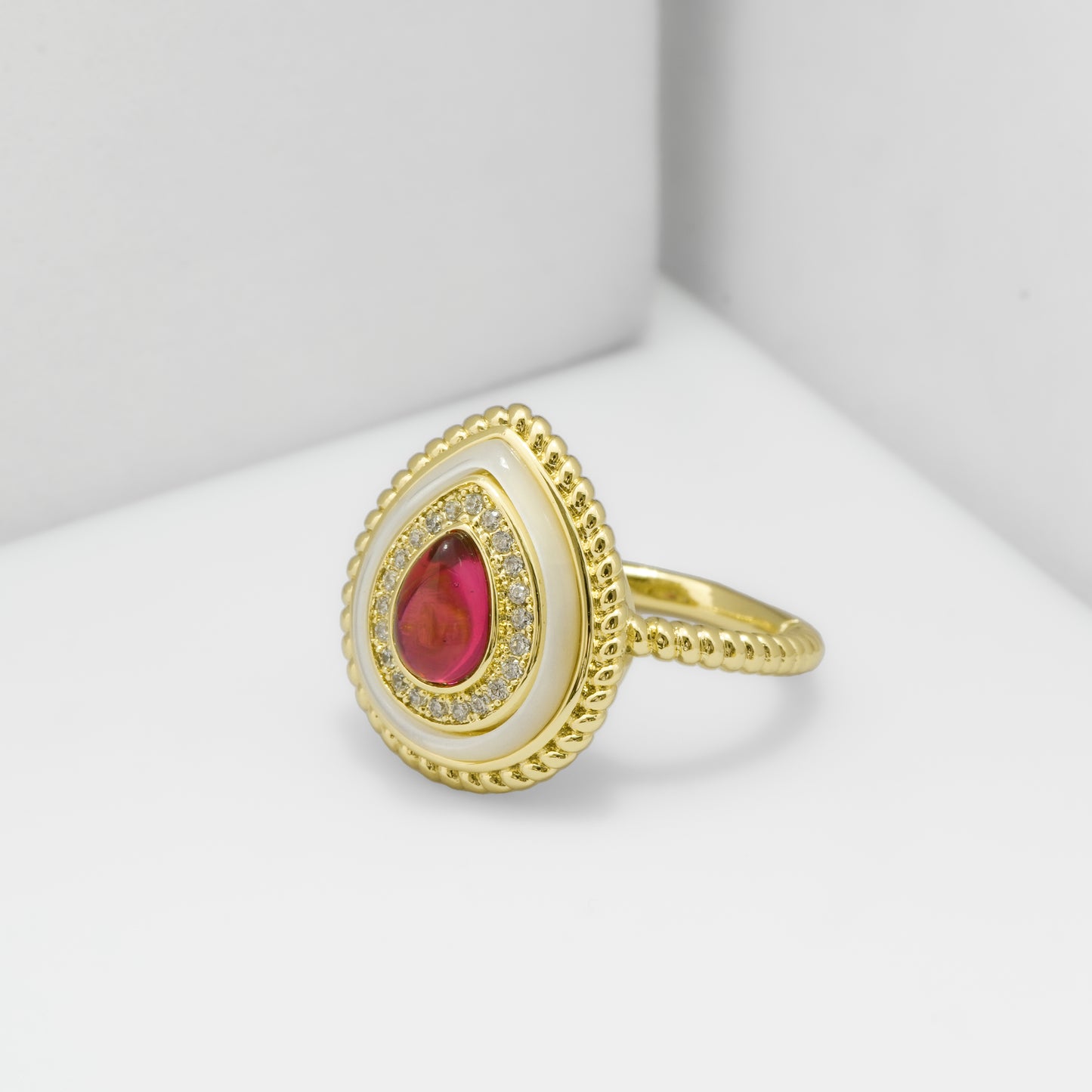 Pear Shaped Red Stone Ring for Women with Gold Finish and Crystal Studded Border | Stylish Fashion Jewelry for Party, Wedding and Daily Wear
