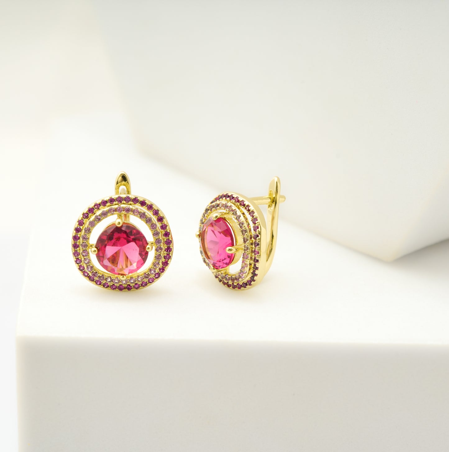 Radiant Gold-Plated Circular Stud Earrings with Dual Halo of Ruby Red Accents and Central Pink Gemstone for Elegant Statement Style