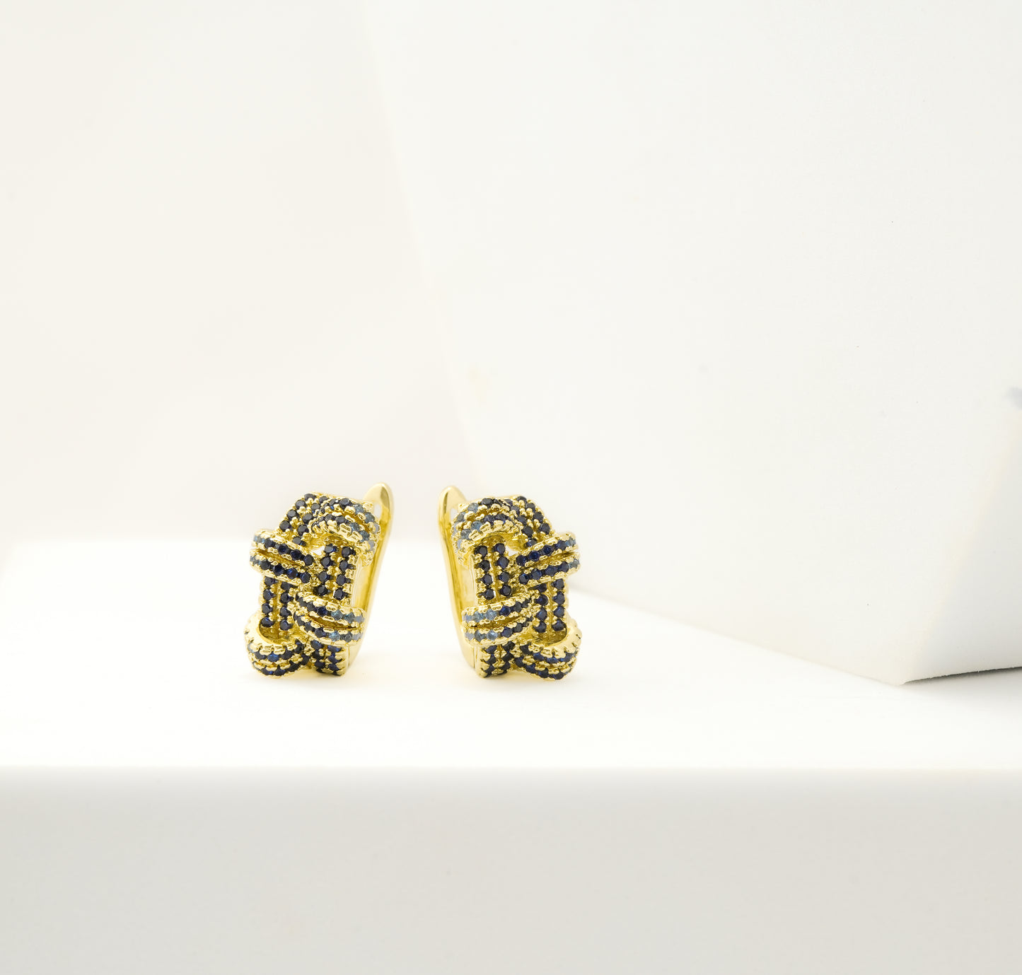 Gold-Plated Interwoven Hoop Earrings with Sapphire Blue Crystal Accents for Statement Luxury