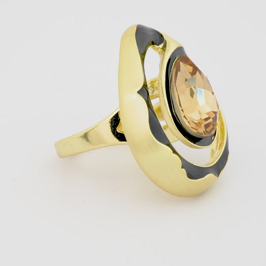 Gold Finish Oval Champagne Stone Ring with Black Enamel Halo and Designer Abstract Setting | Modern Cocktail Jewelry for Parties and Festive Nights