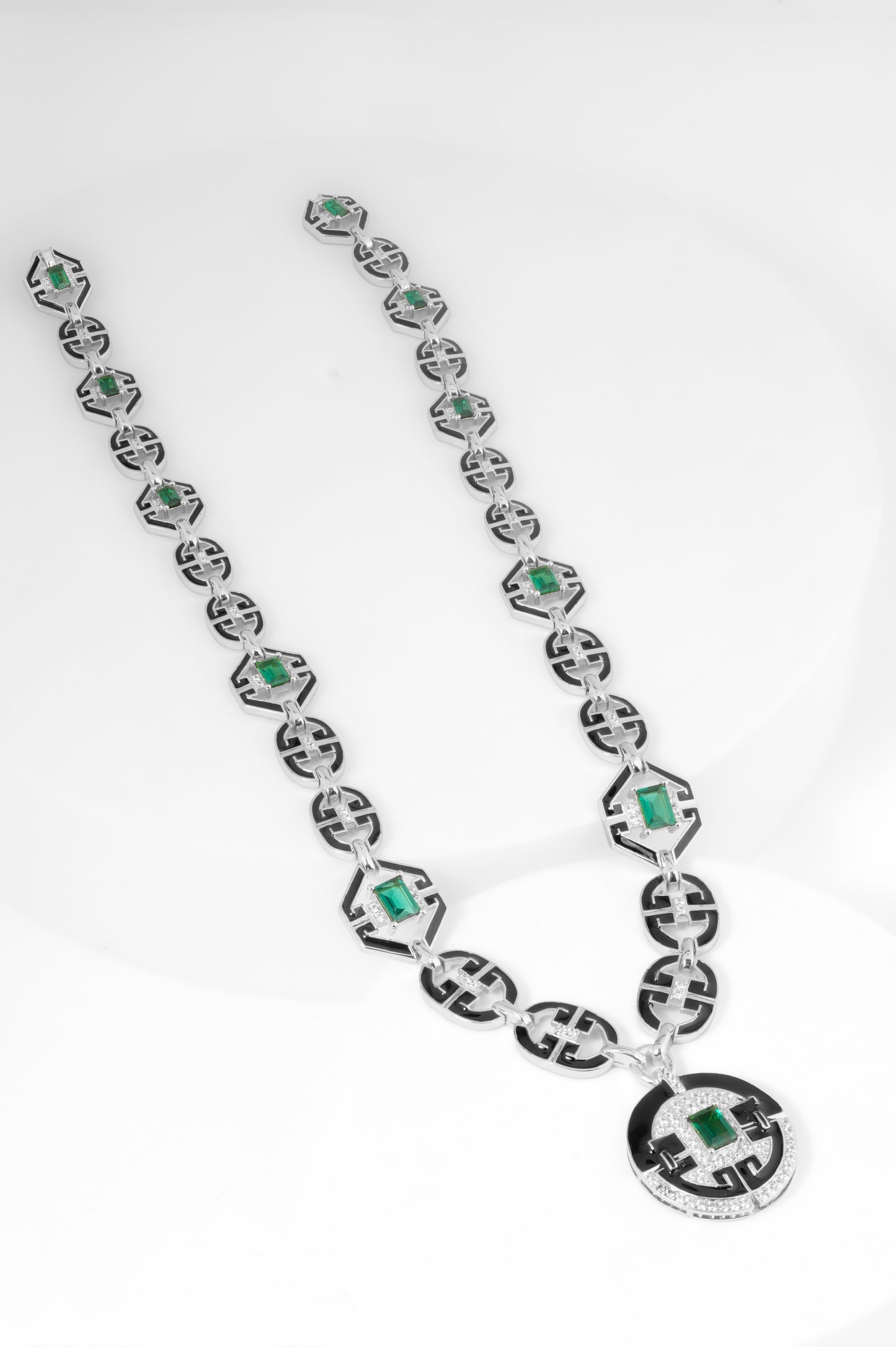 Art Deco Inspired Silver-Tone Statement Necklace with Black Enamel Detailing and Green Stone Accents