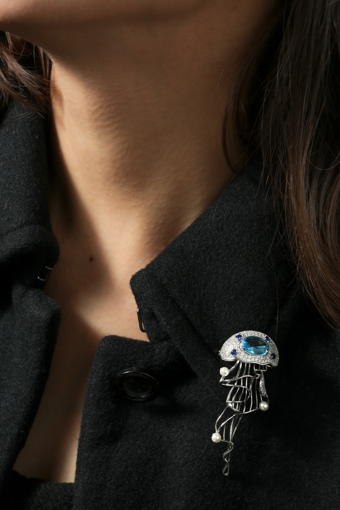 Aquatic Art Pave Brooch | Silver Tone Jellyfish Inspired Brooch with Aquamarine Coloured Center Stone, Blue CZ Accents, Flowing Metal Lines and Pearl Details | Unique Artistic Statement Pin