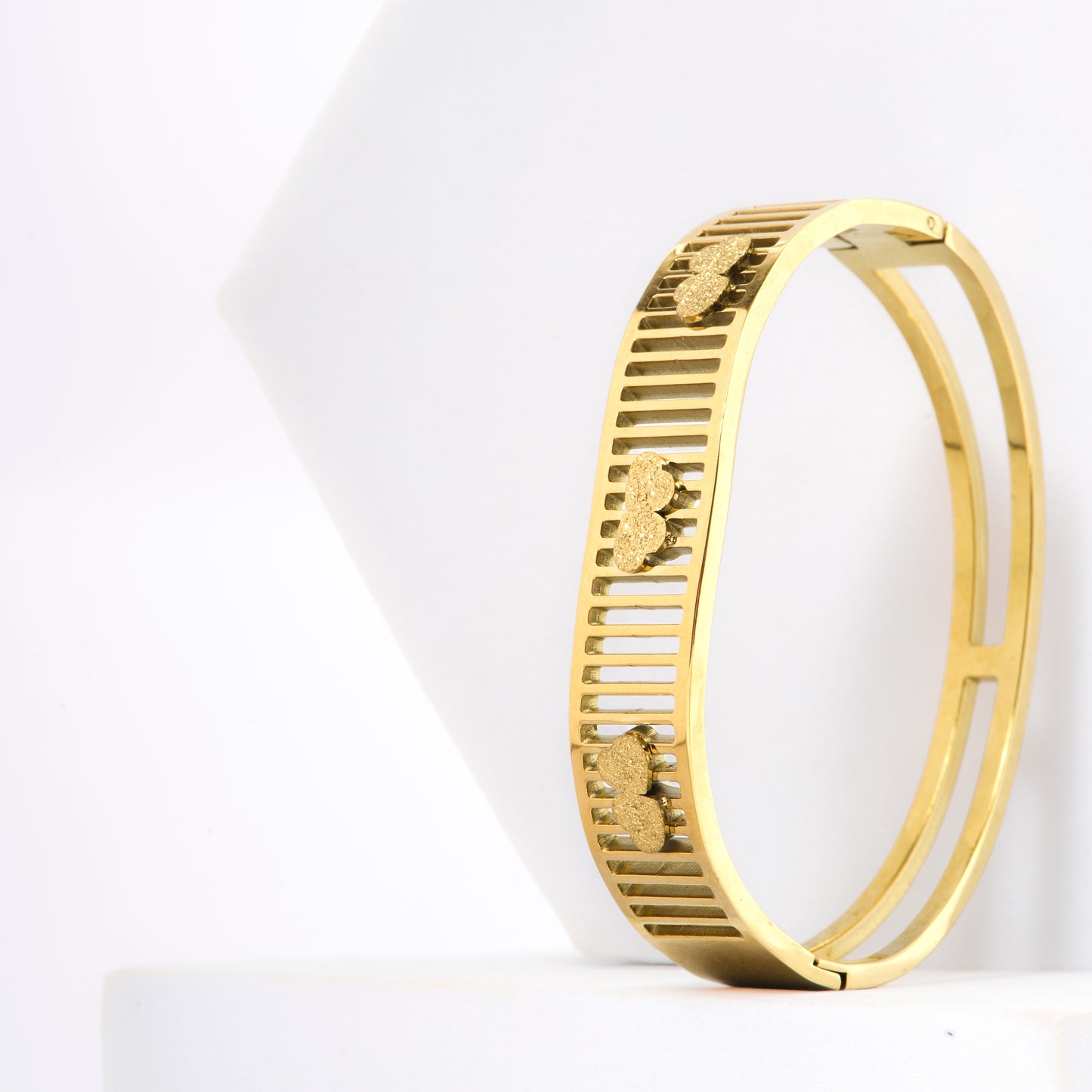 Mahttab Triple Clover Cutout Bracelet | Gold Finished Steel Bangle with V Shaped Frame and Brushed Clover Motifs | Elegant Openwork Bracelet for Daily and Festive Styling