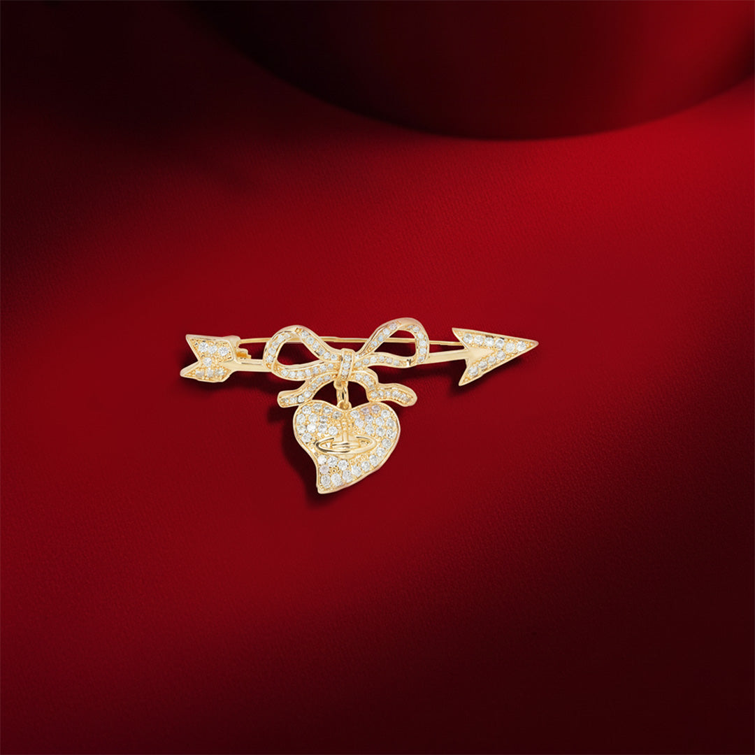 Cupid’s Bow & Heart Brooch | Gold-Tone Pave Arrow Pin with Dangling Heart Charm, Bow Accent & Clear CZ Stones | Romantic Statement Brooch