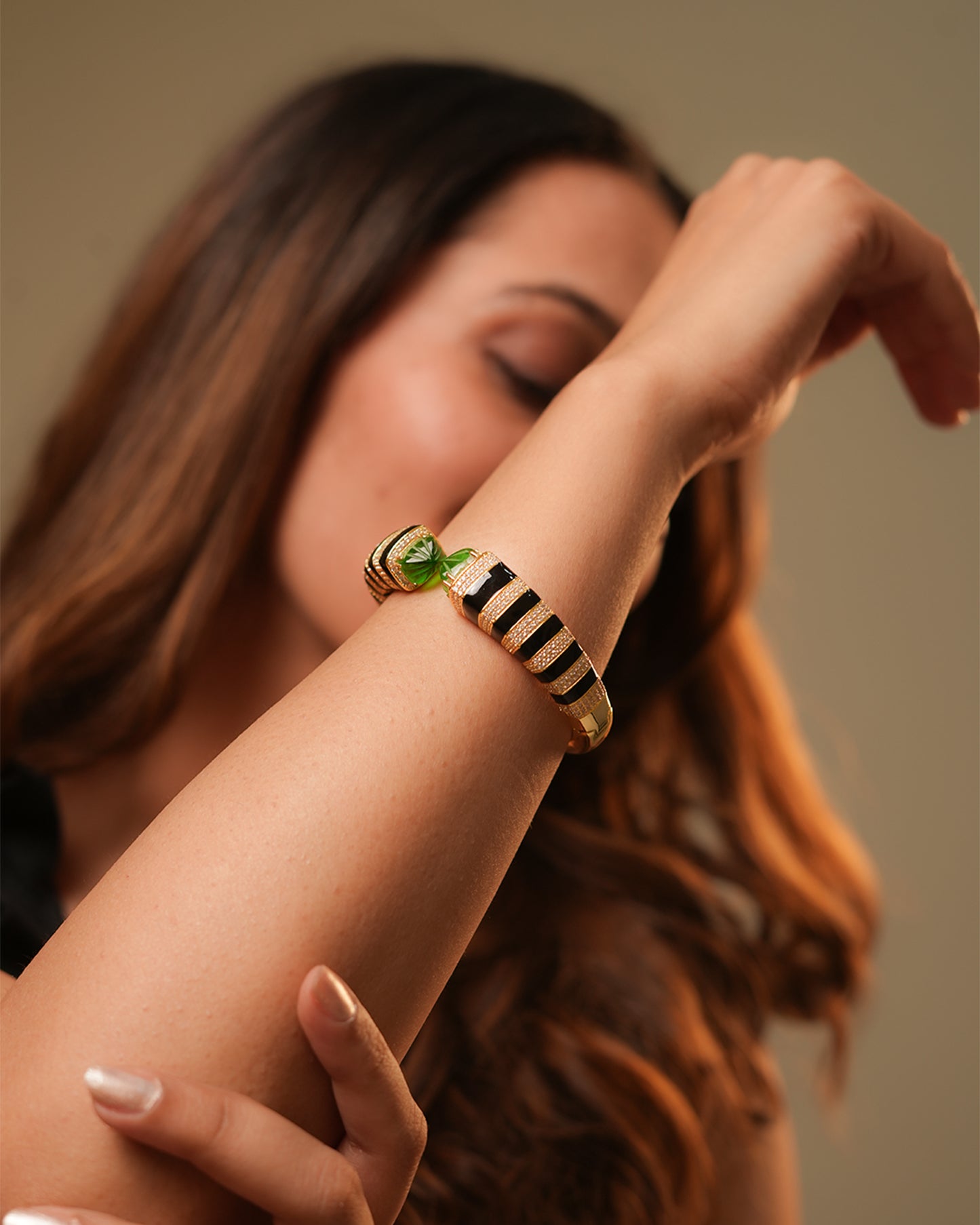 Gold Finish Open Cuff Bracelet with Black Enamel Stripes and Green Gemstone Tips | Luxury Statement Jewelry for Glamorous Occasions