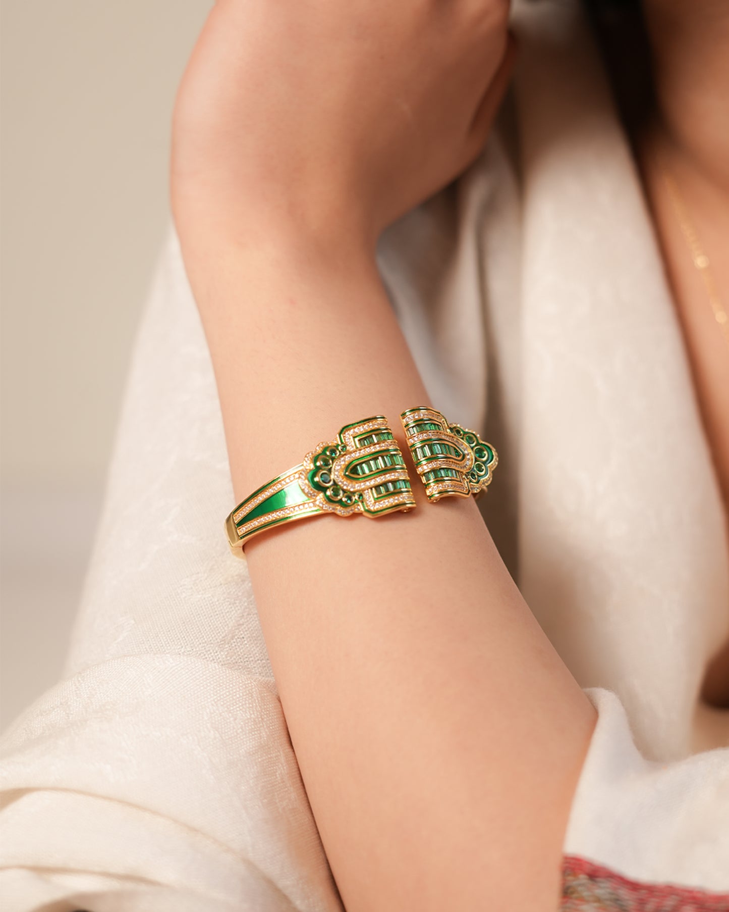Regal Gold-Tone Cuff Bracelet with Emerald Green Stone Detailing and Statement Open-Front Design | Luxury Statement Jewelry for Weddings and Festive Glamour
