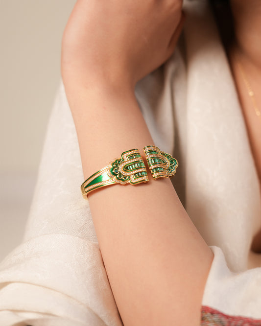 Regal Gold-Tone Cuff Bracelet with Emerald Green Stone Detailing and Statement Open-Front Design | Luxury Statement Jewelry for Weddings and Festive Glamour